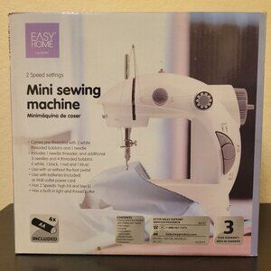 Brand new mini sewing machine in box
